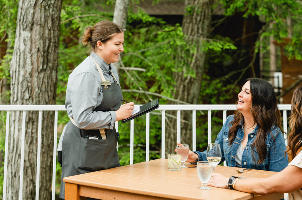 patio-deck-02 Smiling Waitress taking order from customer on the Patio Deck at Dawn Manor in Wisconsin Dells